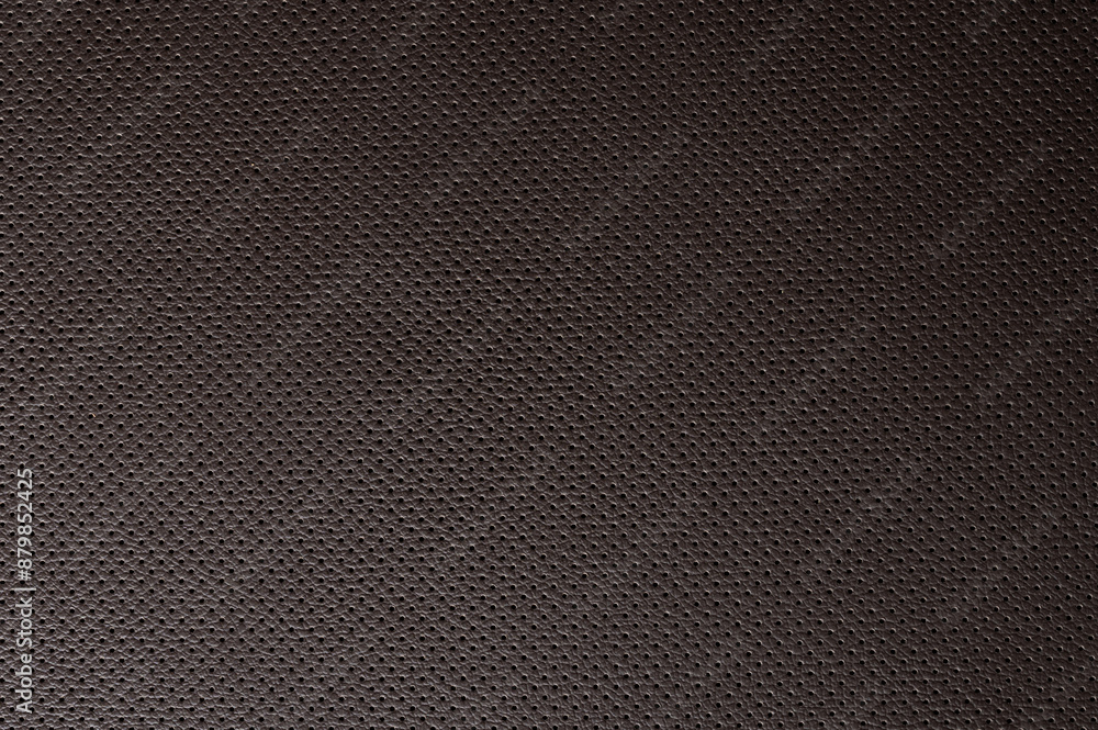 Clean perforated brown leather background Clean perforated brown leather background