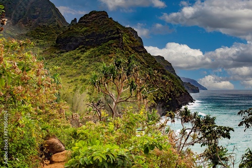 The Na Pali headlands dive into the pacific ocean along the north coast of the island of Kauai, Hawaii. photo