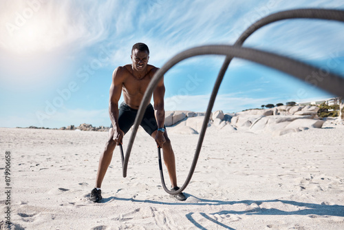 Tablou pe pânză Athlete, fitness and battle ropes on beach for exercise, workout and cardiovascular health outdoor