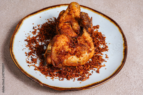 Ayam Goreng Kalasan. Traditional fried chicken with spices from Minangkabau, West Sumatra photo