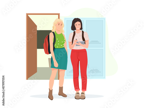Female students talking in front of the classroom.
