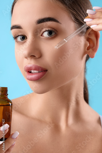 Young woman applying natura...