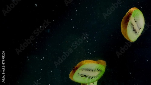 kiwi in the water on a black background