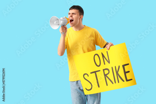 Protesting young man shouti...