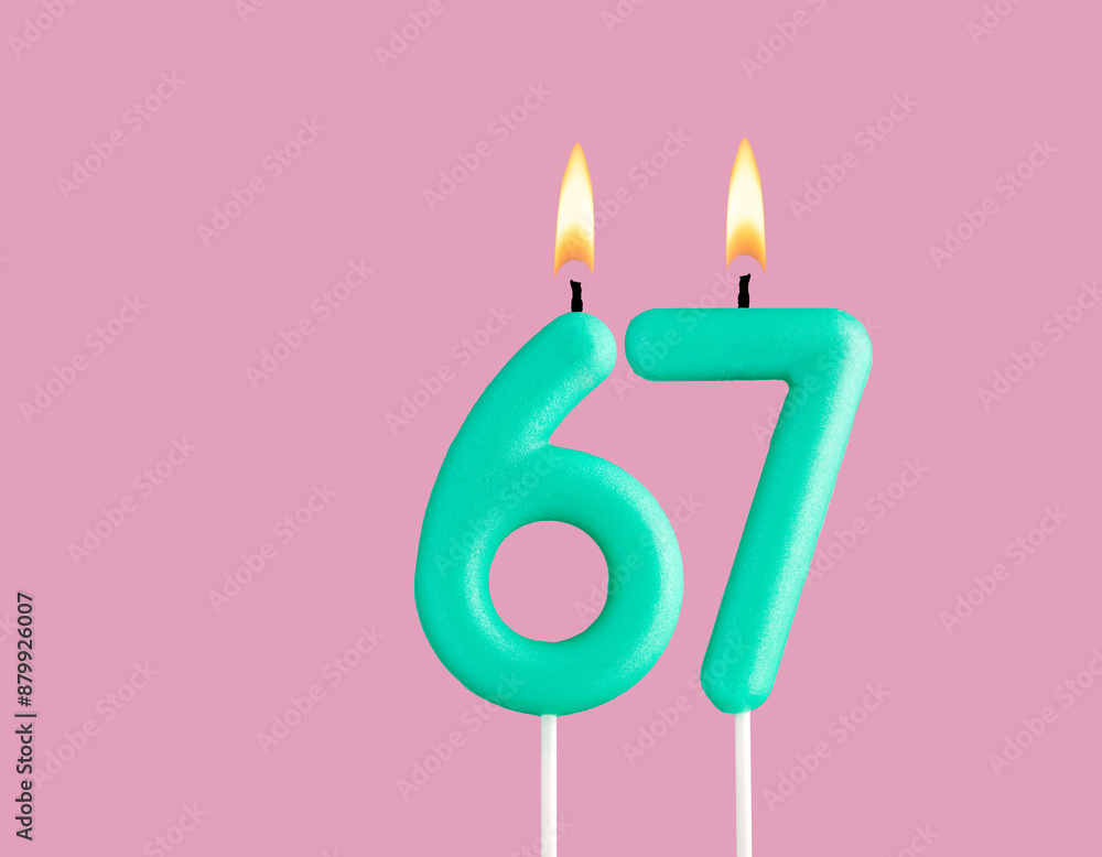 Green candle number 67 - Birthday card on pastel pink background Green candle number 67 - Birthday card on pastel pink background