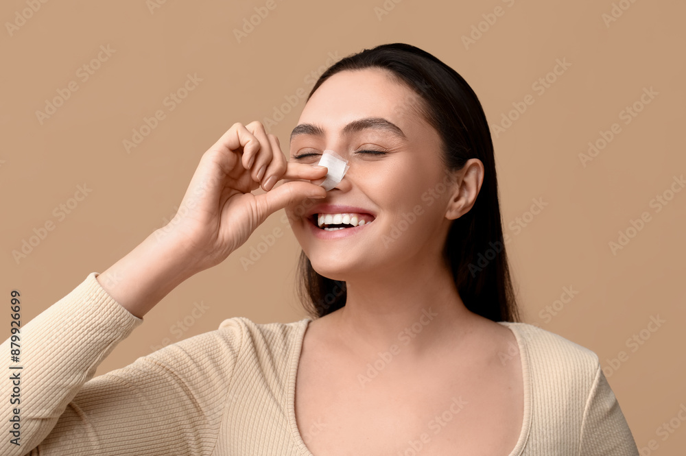 Happy young woman with bandaged nose on brown background. Plastic surgery concept Happy young woman with bandaged nose on brown background. Plastic surgery concept