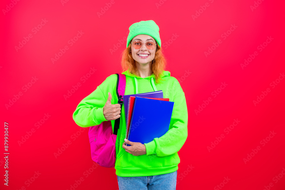 Girl student in college. Back to school. Knowledge day. Education in college. Young girl isolated on pink. September 1. Knowledge and education. School education. Students life. Acquiring knowledge Girl student in college. Back to school. Knowledge day. Education in college. Young girl isolated on pink. September 1. Knowledge and education. School education. Students life. Acquiring knowledge