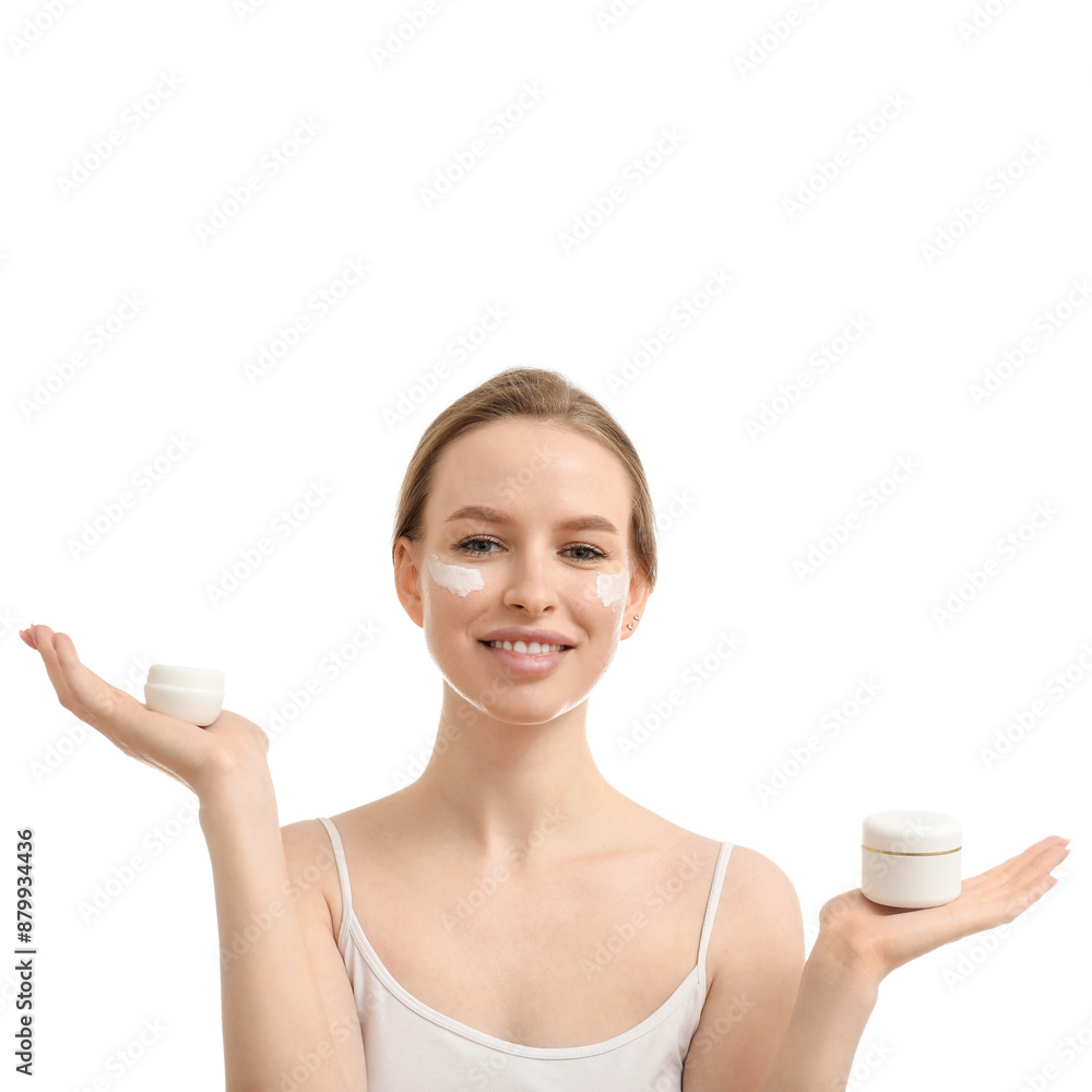 Beautiful woman with jars of facial cream on white background Beautiful woman with jars of facial cream on white background