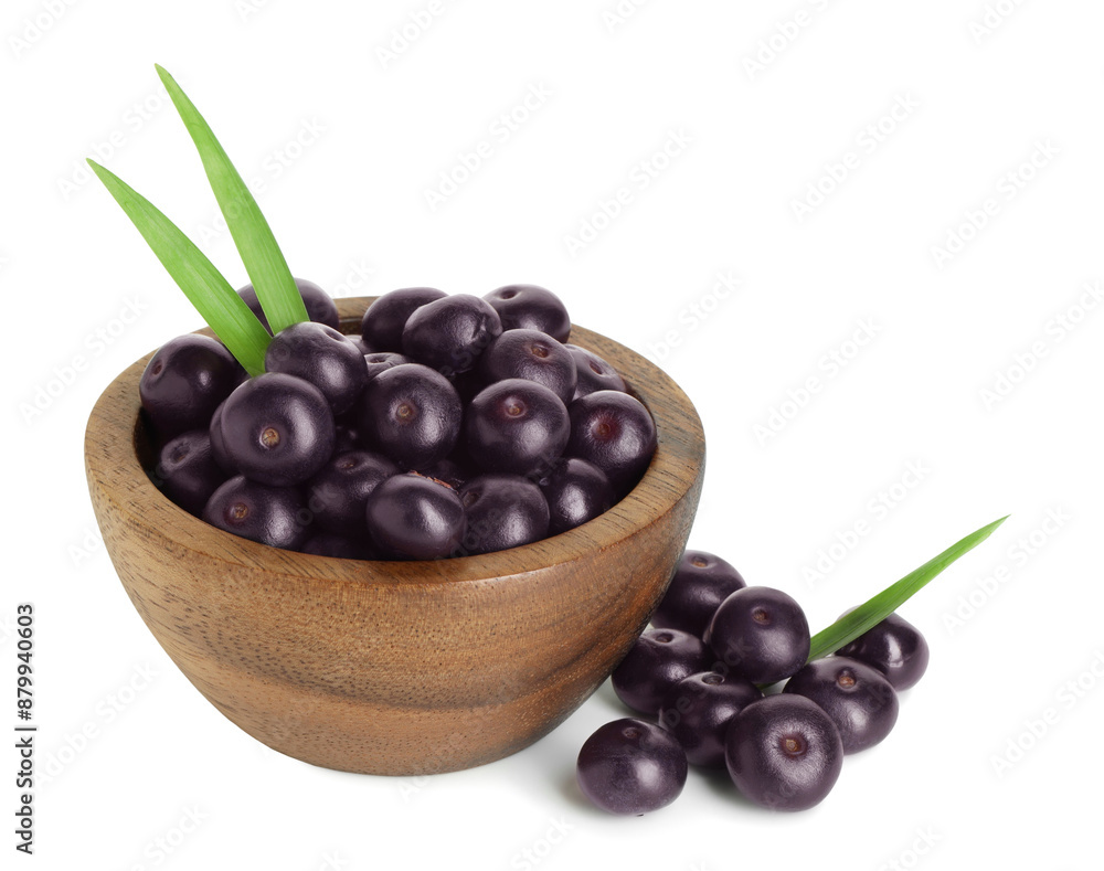 Fresh ripe acai berries in bowl and green leaves isolated on white Fresh ripe acai berries in bowl and green leaves isolated on white