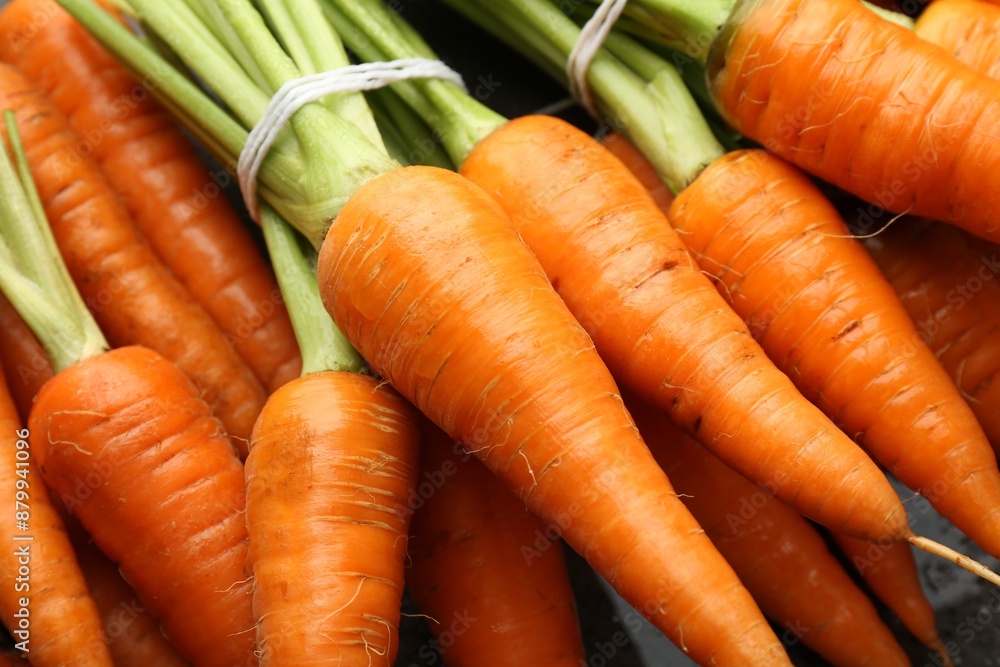 Tasty ripe juicy carrots on table, closeup Tasty ripe juicy carrots on table, closeup