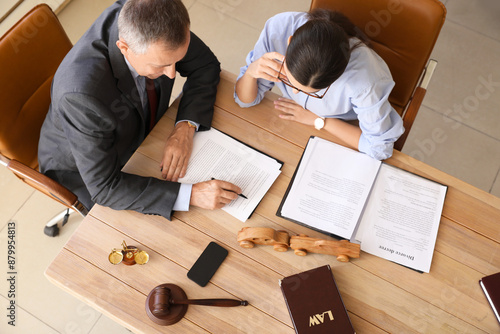 Φωτογραφία Lawyers holding meeting in office, top view