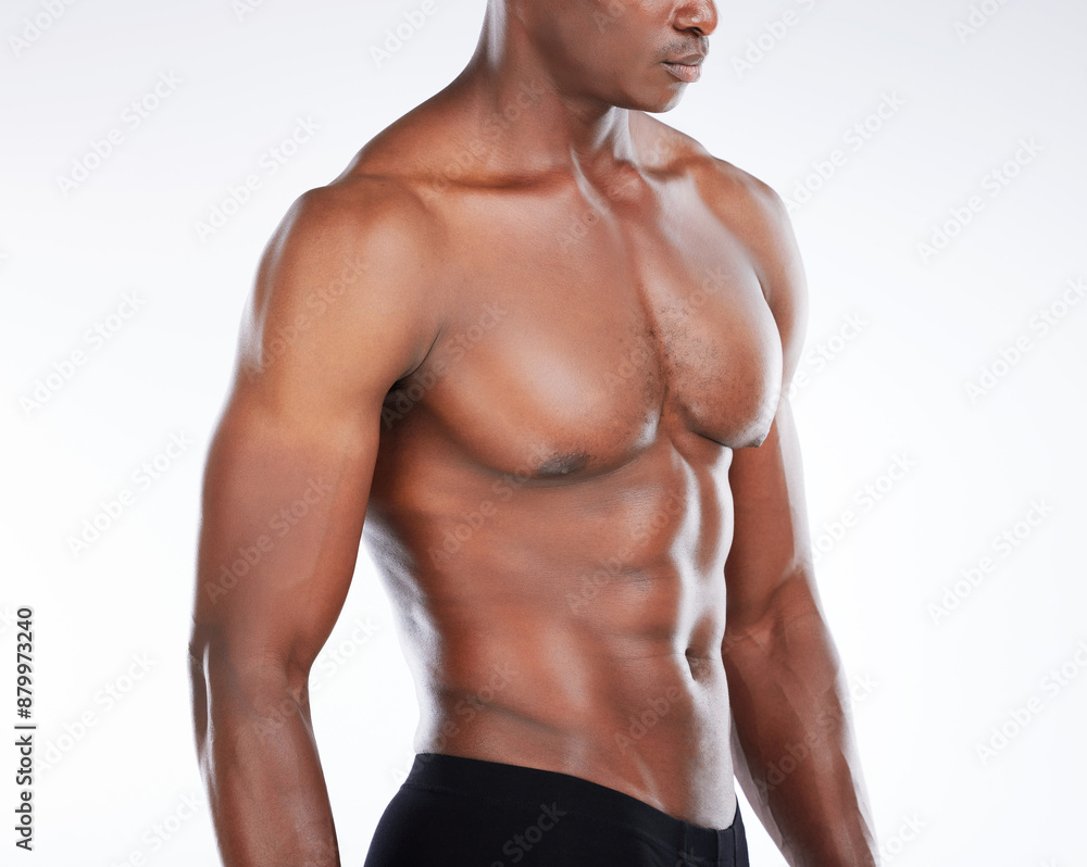 Black man, shirtless and muscular with abs, healthy and wellness on white studio background. African person, bodybuilder and model with muscle, torso and stomach with confidence, macho or athlete Black man, shirtless and muscular with abs, healthy and wellness on white studio background. African person, bodybuilder and model with muscle, torso and stomach with confidence, macho or athlete