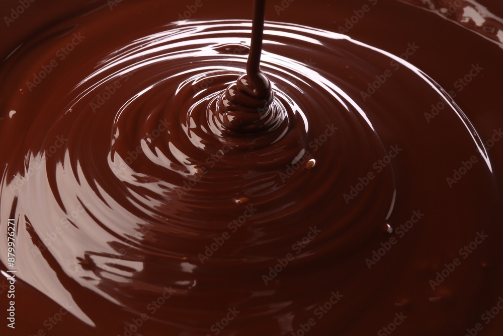 Closeup view of pouring delicious melted chocolate Closeup view of pouring delicious melted chocolate