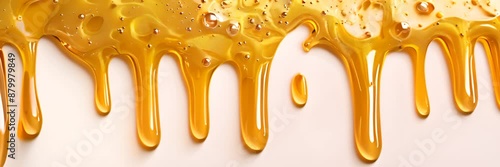 honey or yellow paint dripping on white background