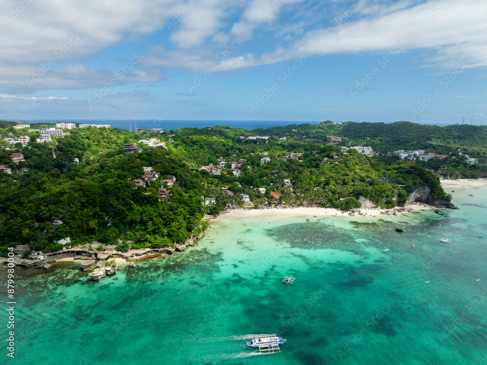 Boats over clear turquoise water with coral reefs. White sand in Diniwid Beach. Boracay Island. Philippines. Boats over clear turquoise water with coral reefs. White sand in Diniwid Beach. Boracay Island. Philippines.
