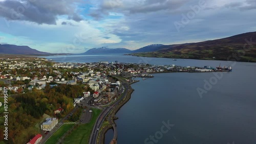 Drone footage of a the city of Akureyri, Iceland, showing the city on the coast of a lake.