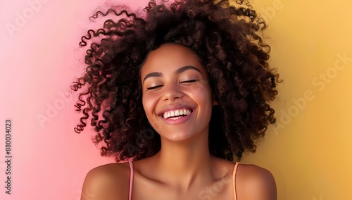 Smiling woman with curly hair against a vibrant, colorful background, exuding joy and positivity, ideal for lifestyle, wellness, and happiness themes.