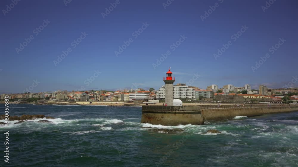 Farolim de Felgueiras lighthouse in Porto Portugal seaside. Beautiful lighthouse on the coast of Porto. Felgueiras Lighthouse, Farolim do Molhe de Felgueiras, Atlantic Ocean. Farolim de Felgueiras lighthouse in Porto Portugal seaside. Beautiful lighthouse on the coast of Porto. Felgueiras Lighthouse, Farolim do Molhe de Felgueiras, Atlantic Ocean.