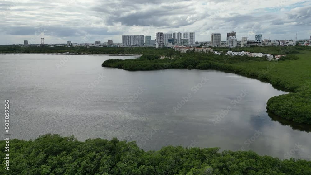 Flyover shallow Nichupte Lagoon toward Cancun Mexico under cloud Flyover shallow Nichupte Lagoon toward Cancun Mexico under cloud