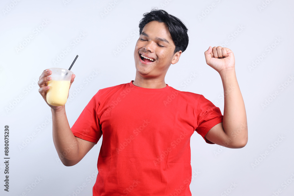 Happy Young Asian Man Enjoyed Drink Juice Isolated On White Background Happy Young Asian Man Enjoyed Drink Juice Isolated On White Background
