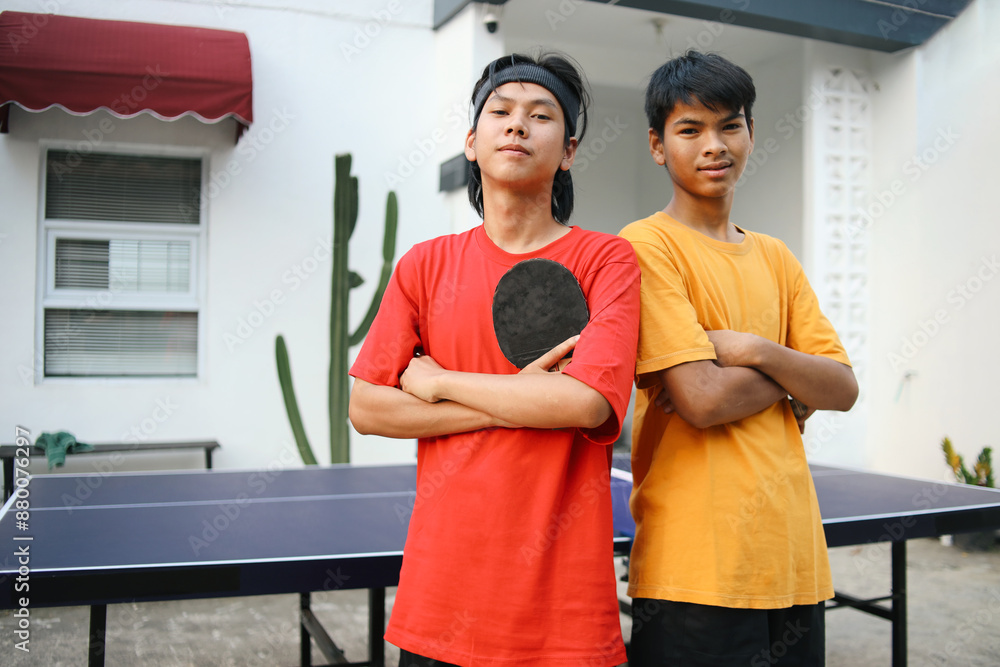 Confidence Of Two Young Asian Sportsman Crossed Keeping Arms While Holding Ping Pong Paddle Confidence Of Two Young Asian Sportsman Crossed Keeping Arms While Holding Ping Pong Paddle