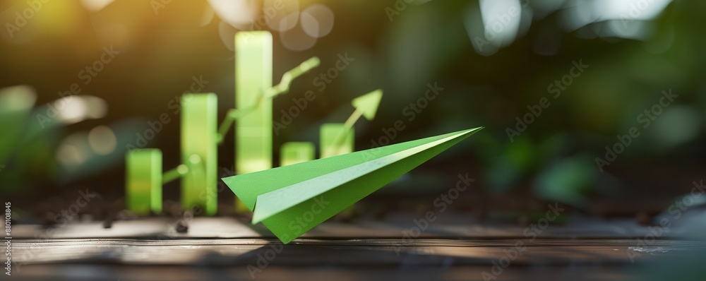 Paper airplane taking flight with green economic data, Business development, Financial success Paper airplane taking flight with green economic data, Business development, Financial success