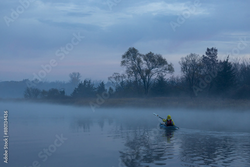 Kayaker in the fog at sunrise Busse Woods Elk Grove Village 