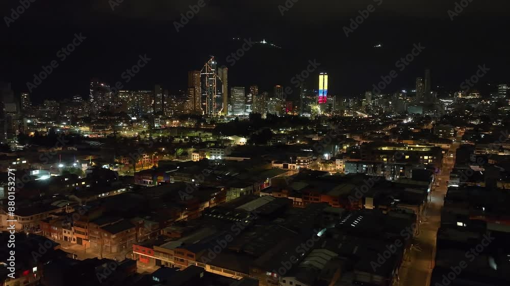 AERIAL: Bogota city skyline in colorful night lights, evening darkness in Colombia AERIAL: Bogota city skyline in colorful night lights, evening darkness in Colombia