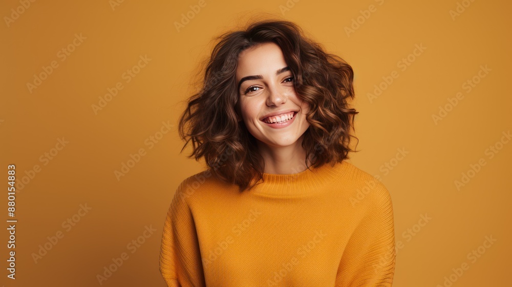 Confident woman posing in a studio, smiling, casual sweater Confident woman posing in a studio, smiling, casual sweater