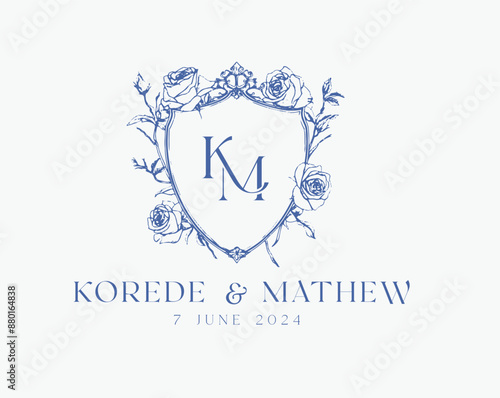 Wedding logo crests vector design royal style blue color illustration monogram crest design with KM initial surrounded by baroque style intricate motifs