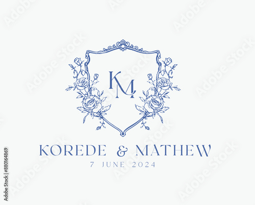 Wedding logo crests vector design royal style blue color illustration monogram crest design with KM initial surrounded by baroque style intricate motifs