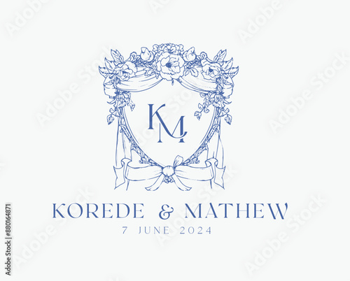 Wedding logo crests vector design royal style blue color illustration monogram crest design with KM initial surrounded by baroque style intricate motifs
