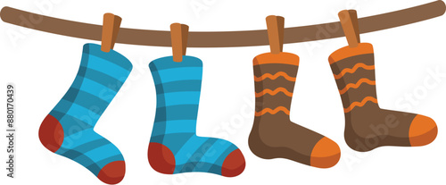 Colorful socks hanging on clothesline drying after laundry