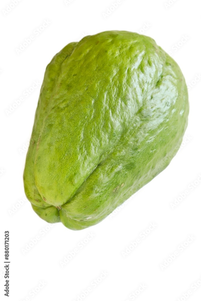A close up shot of a fresh choko (chayote) fruit on white background.