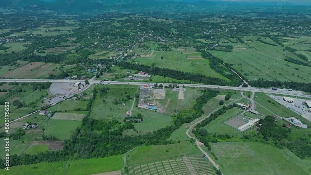 Aerial view of rolling hills and fields in a rural area, showcasing the scenic beauty and agricultural land use. Aerial view of rolling hills and fields in a rural area, showcasing the scenic beauty and agricultural land use.