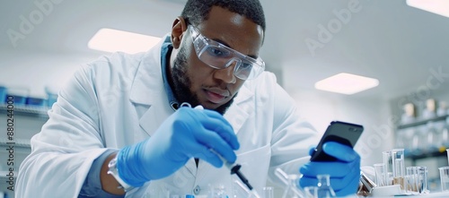 Scientist Working in a Lab, Checking Results on his Phone