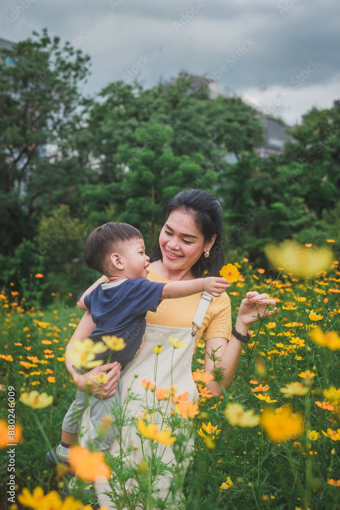 Young Boy Playing in a Field of Yellow Flowers Young Boy Playing in a Field of Yellow Flowers