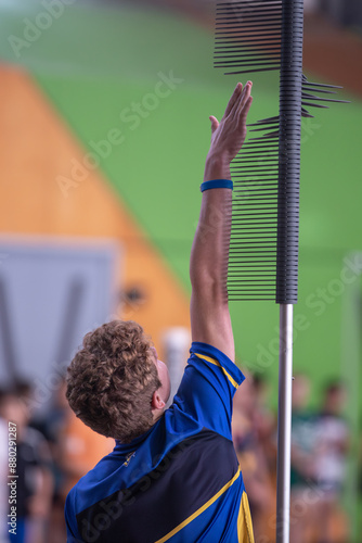 Young athlete vertical leap test with equipment indoor