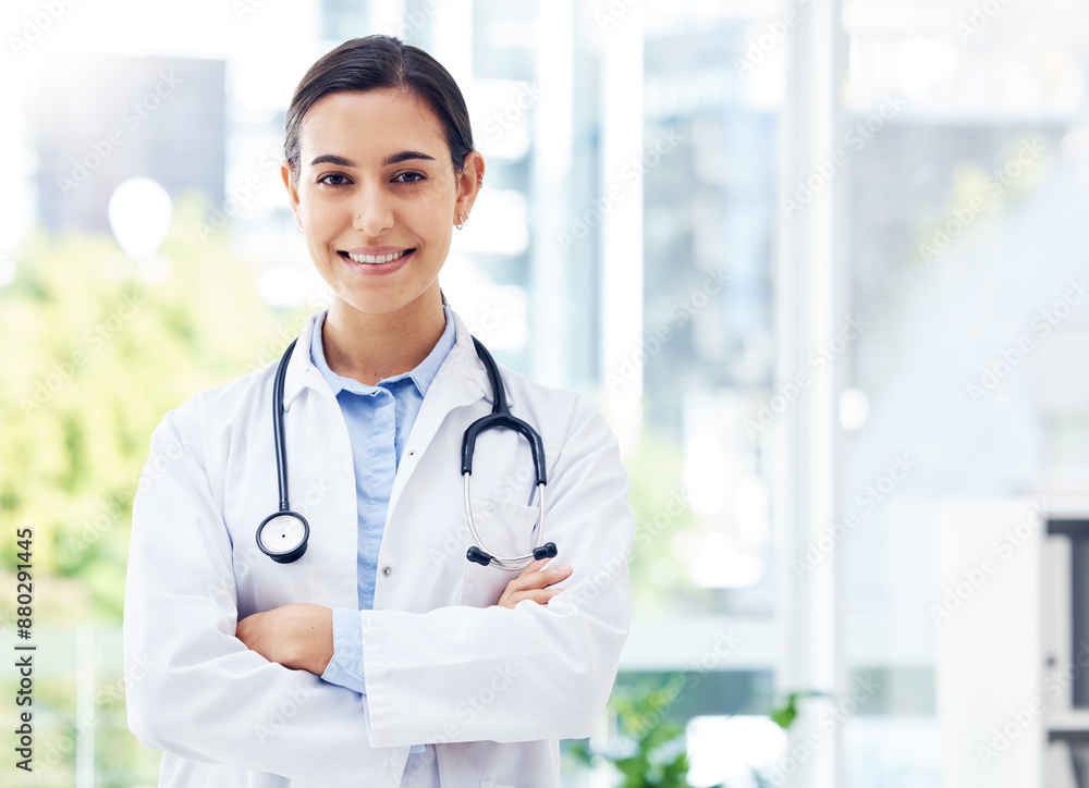 Doctor, confident and portrait in hospital for healthcare, medical advice and wellness with stethoscope. Woman, surgeon and crossed arms in clinic for job, experience and health with happiness Doctor, confident and portrait in hospital for healthcare, medical advice and wellness with stethoscope. Woman, surgeon and crossed arms in clinic for job, experience and health with happiness