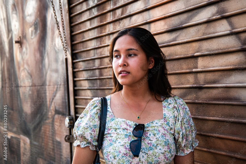 Fototapeta premium Portrait of a Generation Z female on the Sstreet