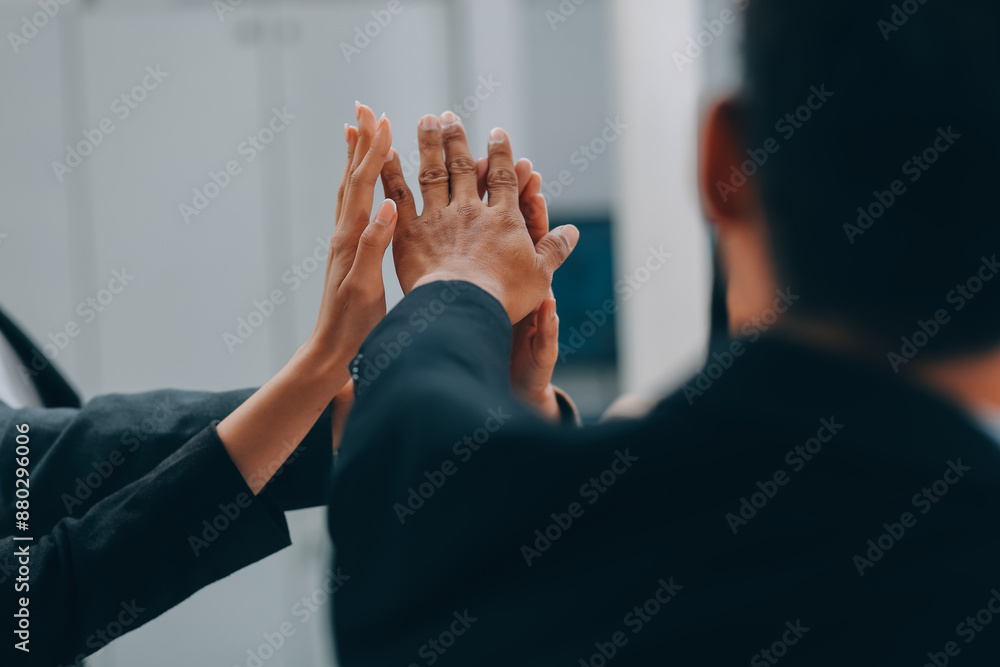 Motivated successful business team giving high five, happy young students employees group join hands with senior teacher mentor, team building unity concept, help support in teamwork, close up view Motivated successful business team giving high five, happy young students employees group join hands with senior teacher mentor, team building unity concept, help support in teamwork, close up view