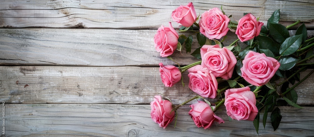 Pink roses bouquet on wooden backdrop with copy space image. Pink roses bouquet on wooden backdrop with copy space image.