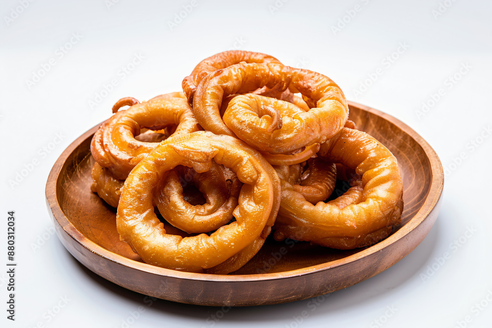 a wooden bowl filled with fried onion rings a wooden bowl filled with fried onion rings