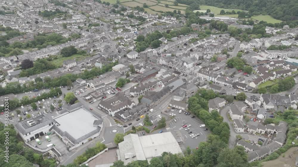 Drone view of the centre of Okehampton in Devon UK, featuring town buildings, streets, and greenery Drone view of the centre of Okehampton in Devon UK, featuring town buildings, streets, and greenery