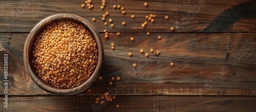 Bowl of uncooked lentils pl...
