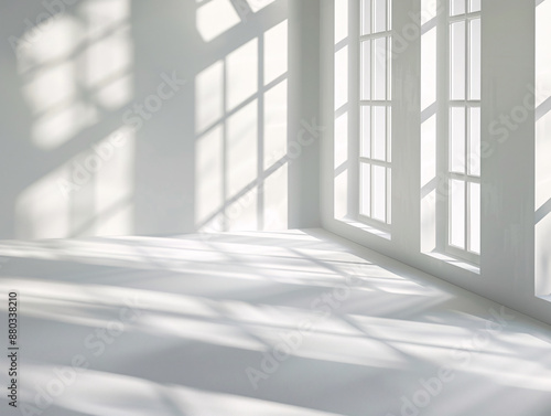 a white room with windows and sunlight