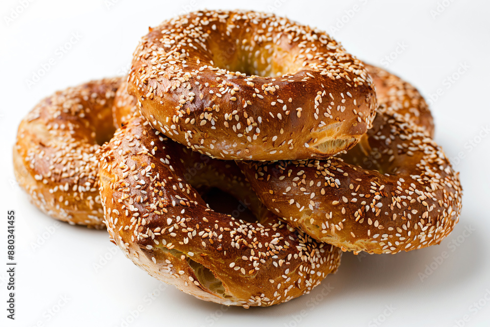 a pile of sesame bagels with sesame seeds a pile of sesame bagels with sesame seeds