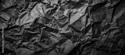 Crumpled black paper with a...