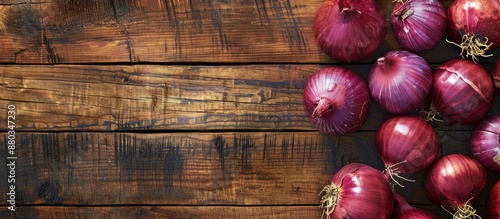 Red Onions on a bright wood...