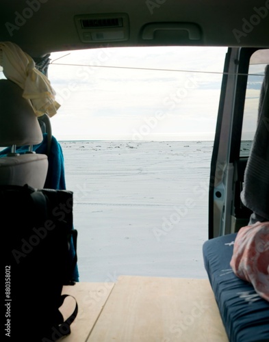 view ot the slidingdoor of a van on the beach photo